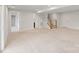 Unfinished basement with access to bathroom and stairwell at 207 Welcombe St, Mooresville, NC 28115