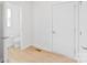 A clean bathroom featuring a toilet, small sink and a door at 207 Welcombe St, Mooresville, NC 28115