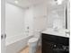 Bathroom featuring a shower and tub combination, a toilet, and a vanity sink with dark cabinets at 207 Welcombe St, Mooresville, NC 28115