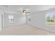 Expansive bedroom with carpet, three windows, and a ceiling fan at 207 Welcombe St, Mooresville, NC 28115
