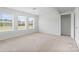 Large bedroom with three windows and neutral carpet at 207 Welcombe St, Mooresville, NC 28115