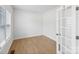 Bright bedroom with neutral walls, hardwood floors, and a large window, creating a serene space at 207 Welcombe St, Mooresville, NC 28115