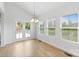 Bright dining room with backyard view through big windows and sliding doors at 207 Welcombe St, Mooresville, NC 28115