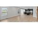 Open-concept kitchen and living area featuring black cabinets and bright windows at 207 Welcombe St, Mooresville, NC 28115