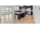 Modern kitchen with dark cabinets, granite countertops and stainless steel appliances at 207 Welcombe St, Mooresville, NC 28115
