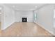 Spacious living room with luxury vinyl flooring and a cozy fireplace at 207 Welcombe St, Mooresville, NC 28115