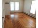 Spacious room with hardwood floors, featuring natural light from two large windows at 209 14Th Se Ave, Hickory, NC 28602