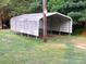 Exterior view of a metal carport with a grassy yard at 209 14Th Se Ave, Hickory, NC 28602