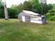 Exterior view of weathered wood shed with a grassy yard at 209 14Th Se Ave, Hickory, NC 28602