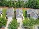 An aerial view of the homes featuring manicured lawns and attached garages at 21214 W Tern Ct, Fort Mill, SC 29707