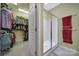 Bright bathroom featuring a glass door shower and access to a well-organized walk-in closet at 21214 W Tern Ct, Fort Mill, SC 29707