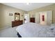 Bedroom with neutral carpet, closet, and access to the bathroom and living areas at 21214 W Tern Ct, Fort Mill, SC 29707