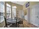 Bright breakfast nook with lots of natural light and breakfast table with chairs, adjacent to laundry at 21214 W Tern Ct, Fort Mill, SC 29707