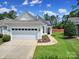 Charming one-story home featuring a spacious garage and well-manicured lawn at 21214 W Tern Ct, Fort Mill, SC 29707