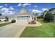 Well-maintained home with an attached garage and a beautifully landscaped front yard at 21214 W Tern Ct, Fort Mill, SC 29707