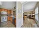 View of the kitchen and dining area with wood cabinets and stainless steel appliances at 21214 W Tern Ct, Fort Mill, SC 29707