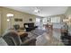 Open living space features wood floors, sitting area, access to the dining room, and backyard at 21214 W Tern Ct, Fort Mill, SC 29707