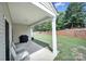 Covered back patio with view of lawn and retaining wall at 21214 W Tern Ct, Fort Mill, SC 29707