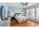 Light blue bedroom features a ceiling fan, and natural light from the window at 23117 Whimbrel Cir, Fort Mill, SC 29707