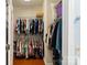 Walk-in closet with built-in shelving provides ample storage space for clothes and accessories at 23117 Whimbrel Cir, Fort Mill, SC 29707
