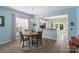 Dining area with a chandelier, hardwood floors and backyard views at 23117 Whimbrel Cir, Fort Mill, SC 29707