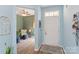 Bright foyer with hardwood floors leading to a sitting area and the rest of the home at 23117 Whimbrel Cir, Fort Mill, SC 29707
