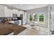 Bright kitchen features stainless steel appliances and an eat-in dining area with a beautiful view at 23117 Whimbrel Cir, Fort Mill, SC 29707