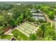 Aerial view of meticulously maintained lawn bowling area with shelters, benches and landscaped paths within a charming community at 23117 Whimbrel Cir, Fort Mill, SC 29707
