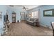 Bright living room with hardwood floors, plenty of natural light, and an open doorway at 23117 Whimbrel Cir, Fort Mill, SC 29707