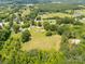 Aerial view shows land ideal for outdoor activities, surrounded by trees and greenery at 2742 Flat Creek Rd, Lancaster, SC 29720