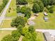 An aerial perspective reveals a house nestled amongst trees, complemented by outbuildings and open land at 2742 Flat Creek Rd, Lancaster, SC 29720