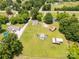 Aerial view showing a sprawling property with various outbuildings, a swimming pool, and ample green space at 2742 Flat Creek Rd, Lancaster, SC 29720