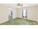 Bright bedroom with floral curtains and a view into another room at 2742 Flat Creek Rd, Lancaster, SC 29720