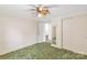 Cozy bedroom features two closets and a ceiling fan with a view into another room at 2742 Flat Creek Rd, Lancaster, SC 29720