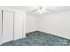 A blank canvas awaits in this simple bedroom with a double closet and ceiling fan at 2742 Flat Creek Rd, Lancaster, SC 29720