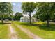 Charming single story home featuring a lush, expansive front lawn and mature shade trees at 2742 Flat Creek Rd, Lancaster, SC 29720