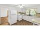 Kitchen featuring standard white appliances and white cabinetry at 2742 Flat Creek Rd, Lancaster, SC 29720