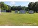 Lawn view of various outbuildings for storage at 2742 Flat Creek Rd, Lancaster, SC 29720