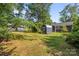 View of the backyard with a shed and a partial view of the house at 309 Ackert Ave, Salisbury, NC 28144