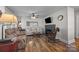 Cozy living room featuring hardwood floors, a fireplace, and comfortable seating area at 309 Ackert Ave, Salisbury, NC 28144