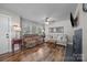 Bright living room with hardwood floors, comfortable seating, and a modern fireplace at 309 Ackert Ave, Salisbury, NC 28144