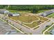 An aerial view shows the neighborhood's community gathering space, swimming pool, and walking paths at 3124 Beacon Heights Rd, Indian Land, SC 29707