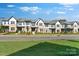 Charming townhome exterior with brick and siding accents, manicured lawn, and inviting curb appeal at 3124 Beacon Heights Rd, Indian Land, SC 29707