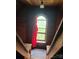 An attic with a window and red fabric hanging at 425 W Horah St, Salisbury, NC 28144