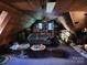 Large attic space with wood paneling, furniture, and stained glass windows at 425 W Horah St, Salisbury, NC 28144