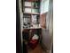 Rustic bar area with open shelving, mirrored backsplash, and distressed cabinets at 425 W Horah St, Salisbury, NC 28144