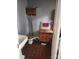 Unique bathroom features vintage toilet and sink, wooden cabinet with mirror, and tile floor at 425 W Horah St, Salisbury, NC 28144