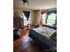 Spacious bedroom with hardwood floors, multiple windows, and vintage furniture at 425 W Horah St, Salisbury, NC 28144