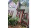 Exterior view of a two-story home with red trim and green siding at 425 W Horah St, Salisbury, NC 28144
