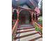 Inviting front porch with detailed woodwork and stairs leading to the entrance at 425 W Horah St, Salisbury, NC 28144